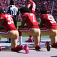 Eric Reid, Colin Kaepernick and Eli Harold of the San Francisco 49ers kneel in protest during the national anthem prior to their NFL game Oct. 23, 2016, in Santa Clara, Calif. In 2017, a high school in Louisiana is threatening to kick student-athletes off its sports teams if they decide to take a knee during the playing of the national anthem at games. (Thearon W. Henderson/Getty Images)